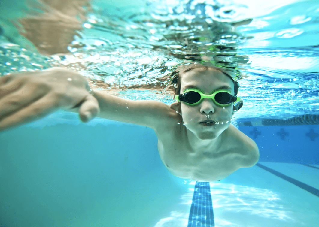 kid swimming underwater