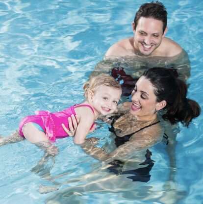 Family of three in the pool